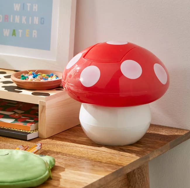the mini mushroom trash can on a desk