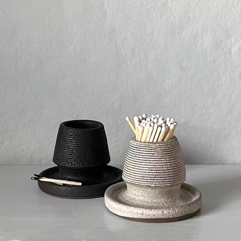 cone shaped match strike with bowl for matches up top