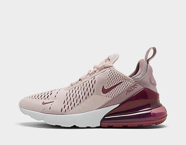 a mauve-pink Nike tennis shoe