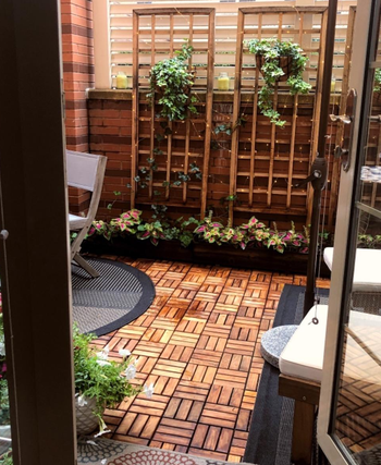 another reviewer's small outdoor space with the teak tiles
