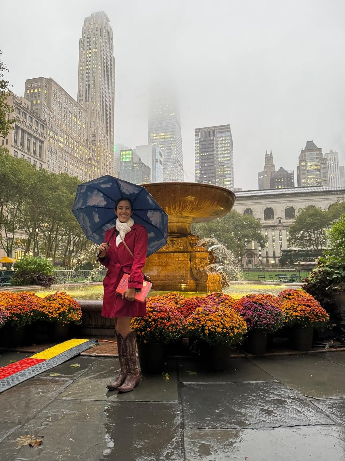 reviewer holding umbrella successful  the park