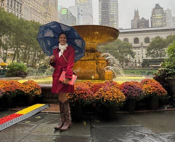 reviewer holding umbrella successful the park