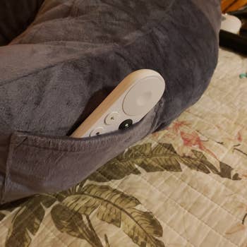 a remote in the pillow's pocket
