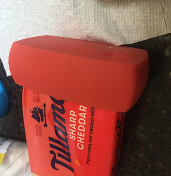 red hugger on the end of a block of cheese