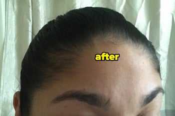 Reviewer with flat, smooth hair and no frizziness or flyaways after using the stick