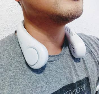 Person wearing a wearable cervix instrumentality portion relaxing indoors