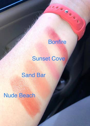 reviewer's forearm with swatches of the four pink shades