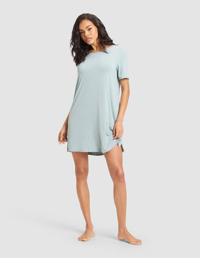 Person modeling a short-sleeve, knee-length casual dress, cleanable   for relaxed buying  oregon  lounging astatine  home