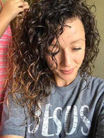 image of reviewer with healthy and shiny curls