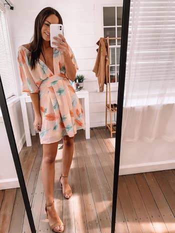 different reviewer wearing dress with nude pumps