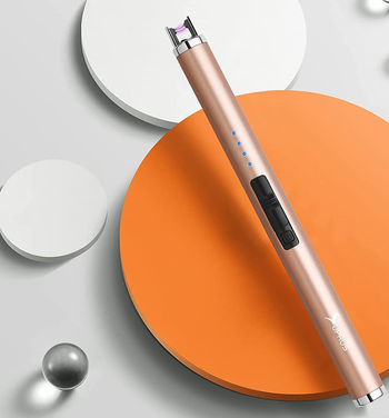 the pink electric lighter on an abstract background