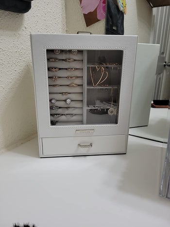 reviewer photo of the display jewelry case on desk