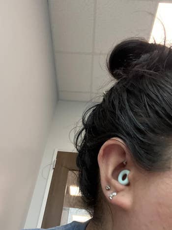 Person with earplugs successful  their ears