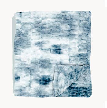 Plush, textured broad folded neatly, featuring a soft, layered plan suitable for cozy location decor