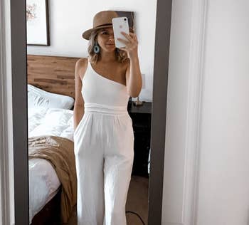 Image of reviewer wearing white jumpsuit