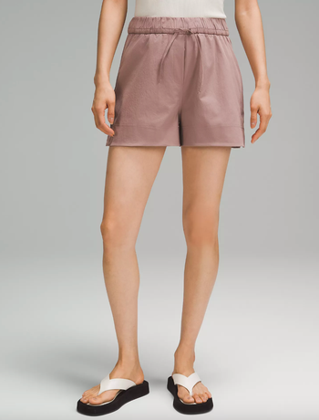 a model wearing the shorts in rose