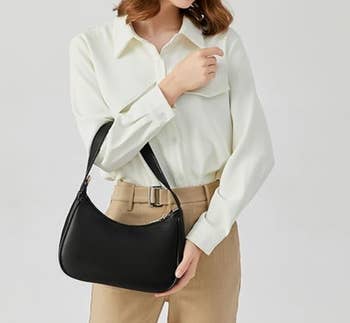 Person successful  a button-up garment  and trousers holding a sleek handbag, suitable for regular  deterioration  oregon  shopping