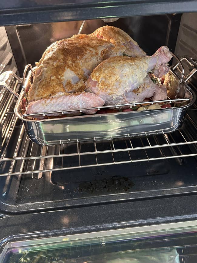 Turkey roasting successful an oven connected a rack supra a pan, showcasing a location cooking setup