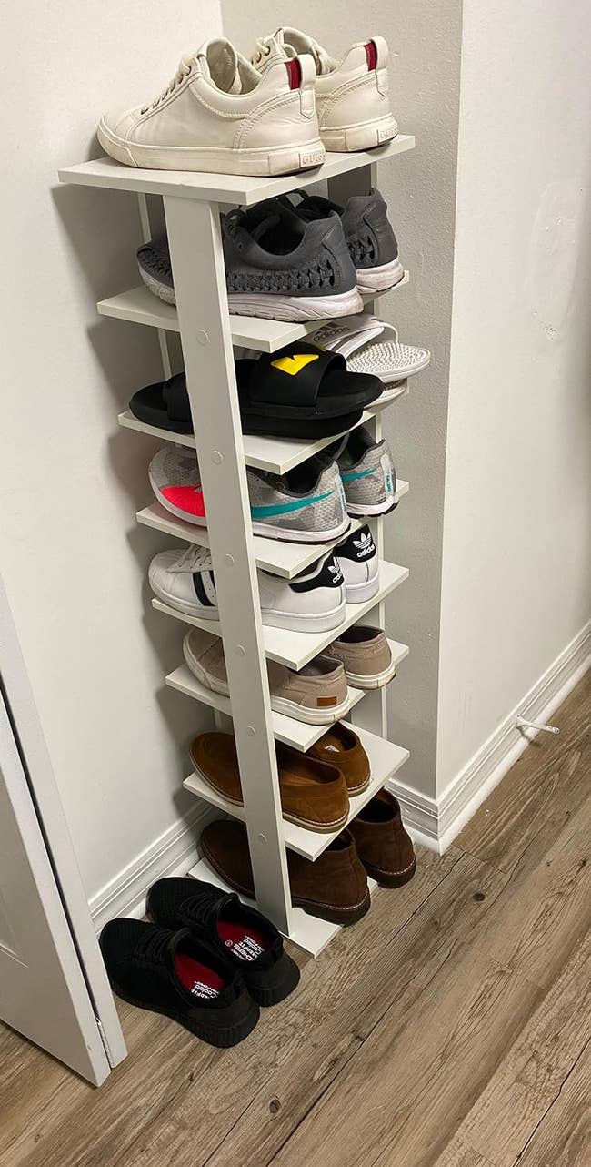 a reviewer photo of the shoe tower loaded up with sneakers 