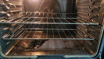 reviewer's photo of the inside of an oven before using the oven cleaner
