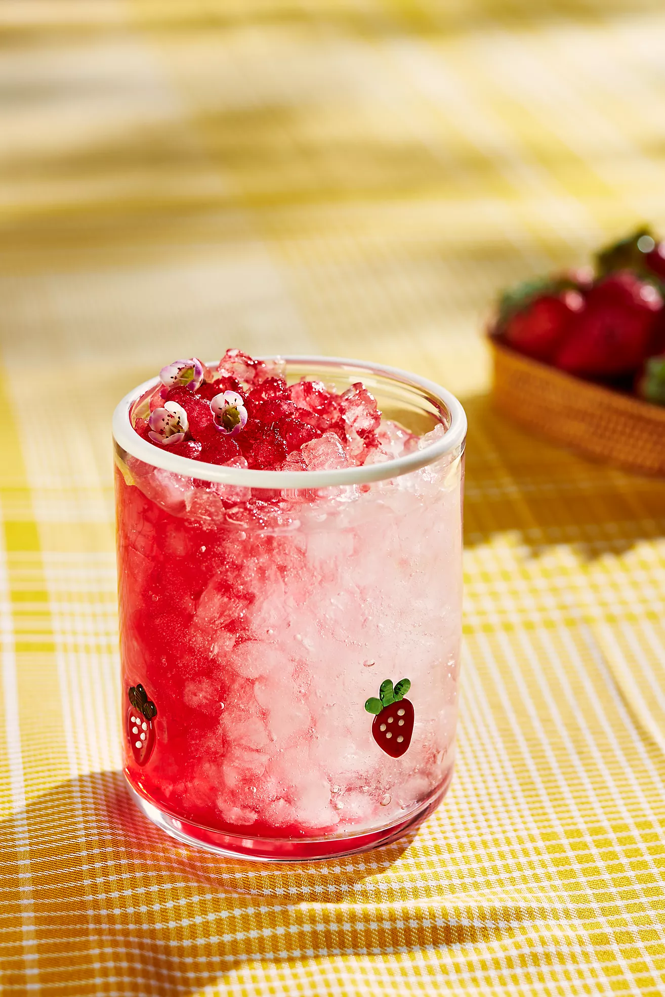 Chilled strawberry portion  with crushed crystal  successful  a solid  featuring strawberry illustrations, acceptable   connected  a checkered array  with caller  strawberries nearby