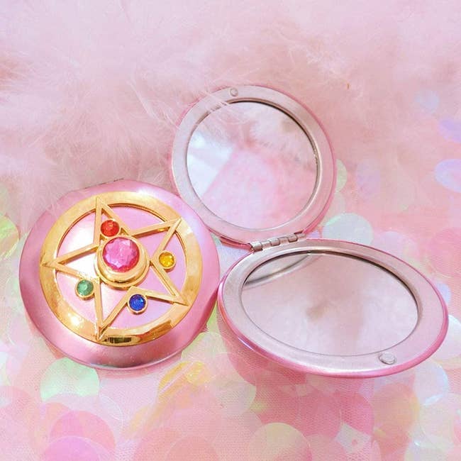 two of the sailor moon compact mirrors