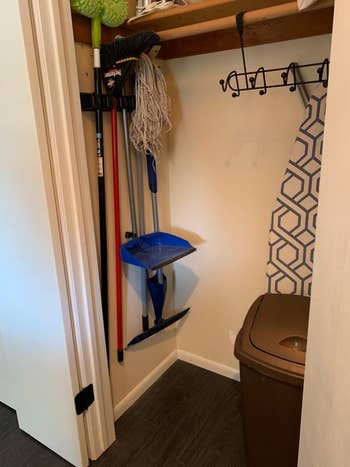 same reviewer showing all the space saved with the broom holder in the closet