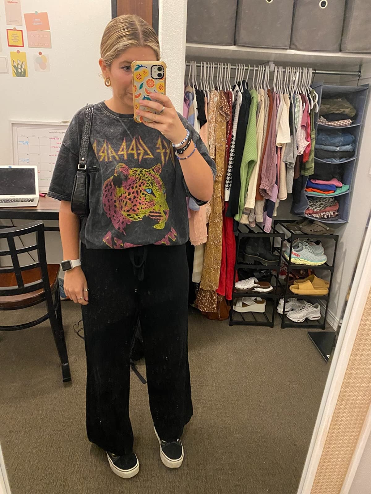 a reviewer in black palazzo pants