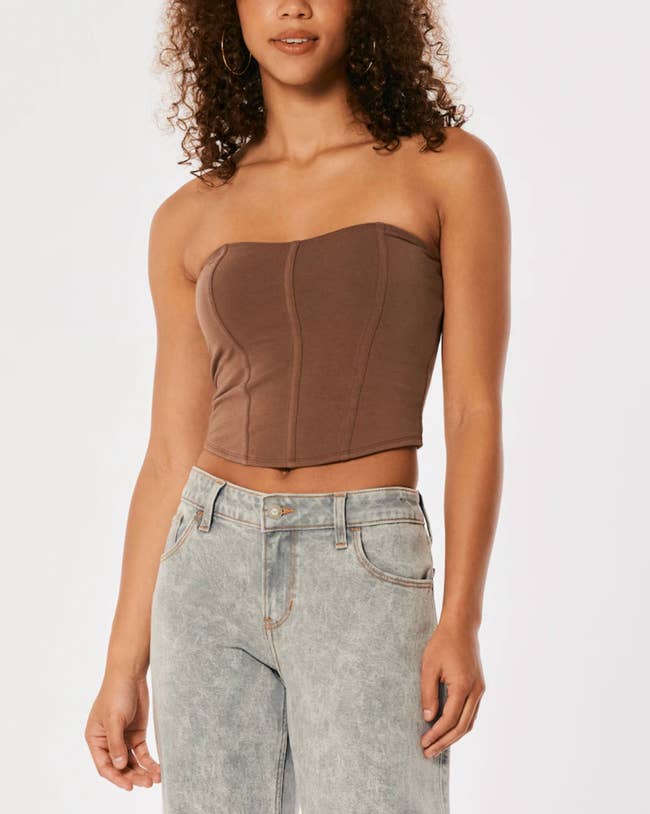 Image of model wearing brown corset top