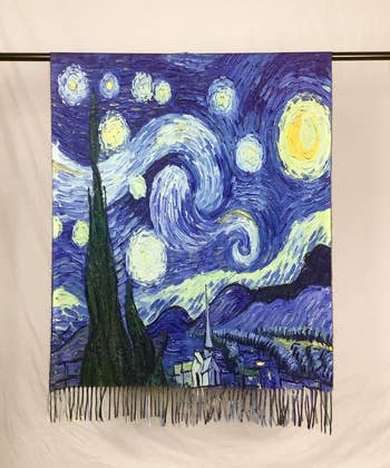 unraveled Starry Night shawl on a rod