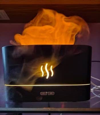 A sleek aroma diffuser emits vapor, perfect  for enhancing country   ambiance. Features a elemental  power  sheet  for casual  use