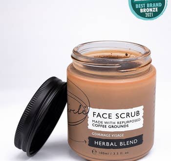 An open jar of the face scrub