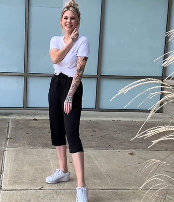 a model wearing the pants in black 