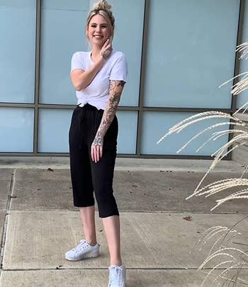 a model wearing the pants in black