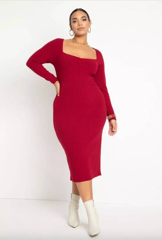 model wearing burgundy long sleeved sweater dress