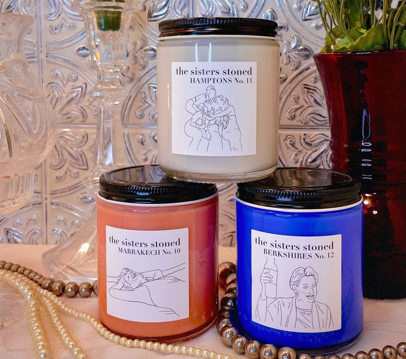 three different real housewives of new york themed candles