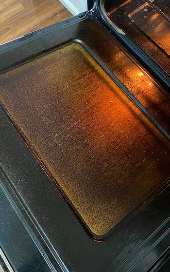 reviewer photo of a dirty stove door window