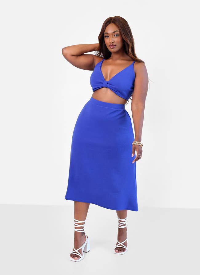 model wearing the blue midi skirt
