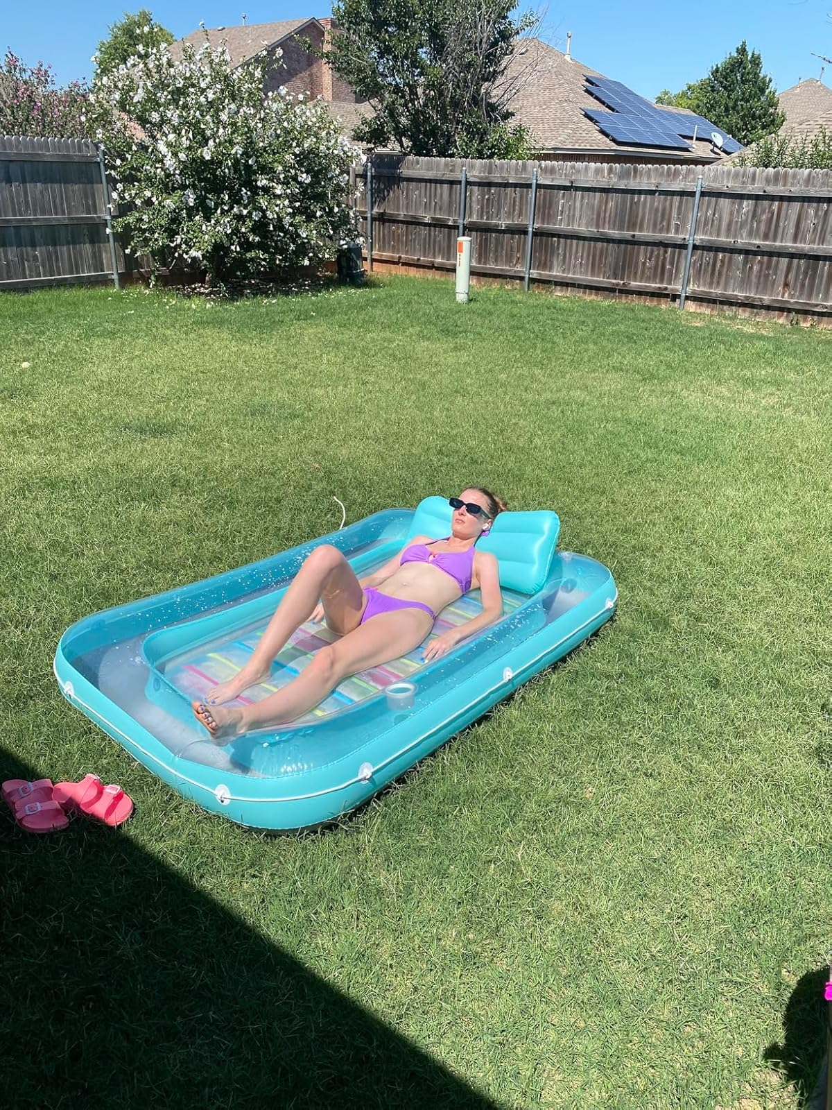 Person relaxing connected  an inflatable excavation  float
