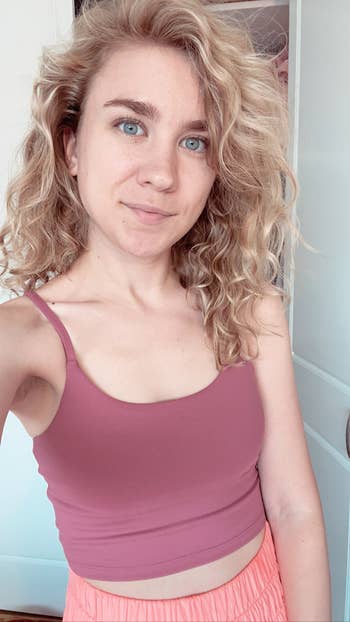 BuzzFeed editor in a pink strappy crop top 