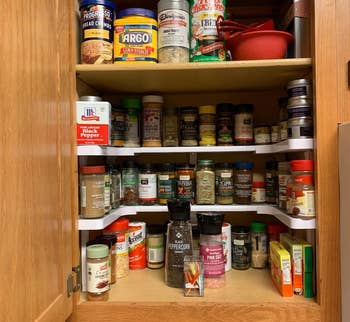 Kitchen cabinet organized with various spices and cooking ingredients, labeled 'After' for a transformation