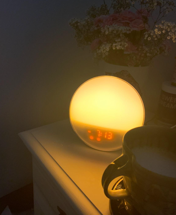 The clock lit up with a warm yellow glow on a reviewer's table