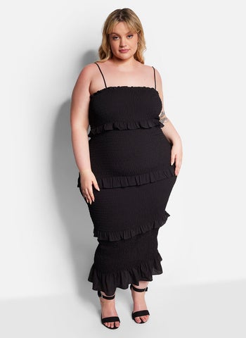 front view of a model in the black tiered bodycon dress