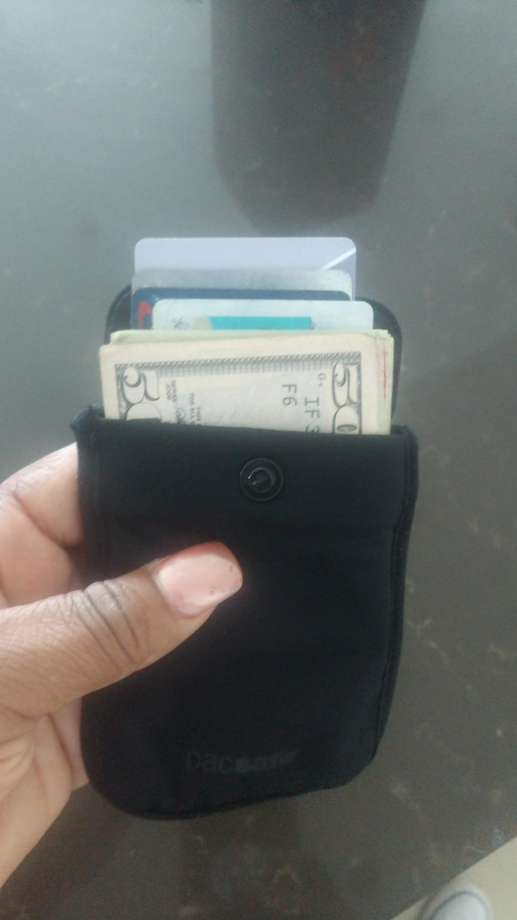 reviewer image of the pouch filled with money and cards