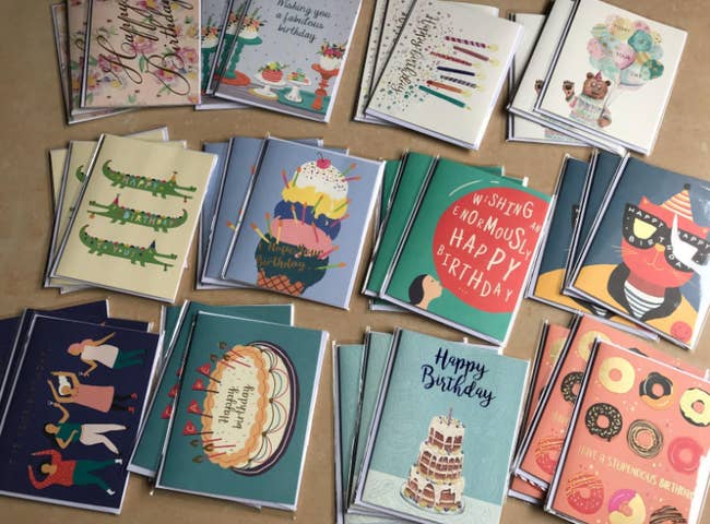 stacks of various illustrated birthday cards