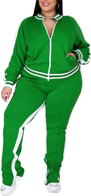 Person successful a sporty, casual greenish tracksuit with achromatic stripes, suitable for progressive oregon leisure wear, lasting successful a relaxed pose