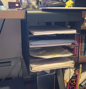 reviewer's desk with the under desk file organizer hung from the front side
