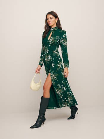 same model wearing the dress in green floral print