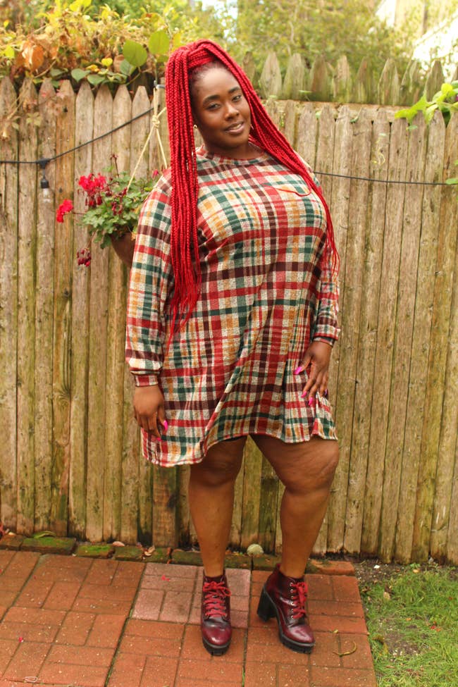 Model wearing the colorful plaid, loose-fit dress
