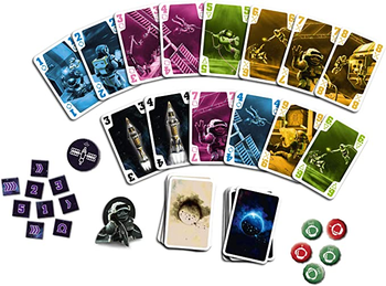 a reviewer photo of the game cards, dice, and tokens 